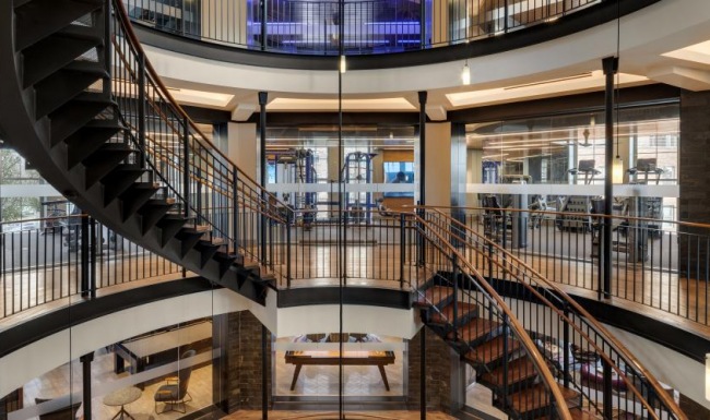 a large modern building with a glass staircase