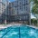 a swimming pool in front of a large building