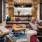 a living room with a tv and couches