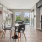 Lounge area with dining tables, chairs, and a TULU rental vending machine