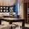 a room with a tv and chairs