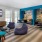 a living room with a couch and chairs